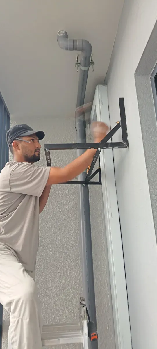 Outdoor compressor bracket securely mounted on wall during aircond installation by KL Renovator