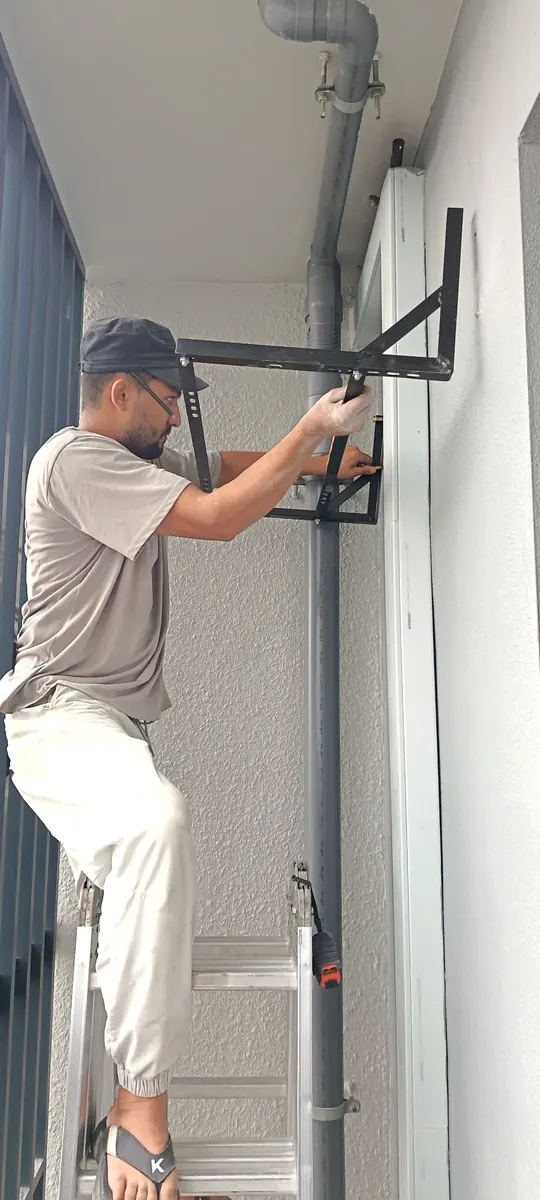 KL Renovator bracket and outdoor compressor installation work in Kuala Lumpur showing real cost components behind aircond installation in Malaysia