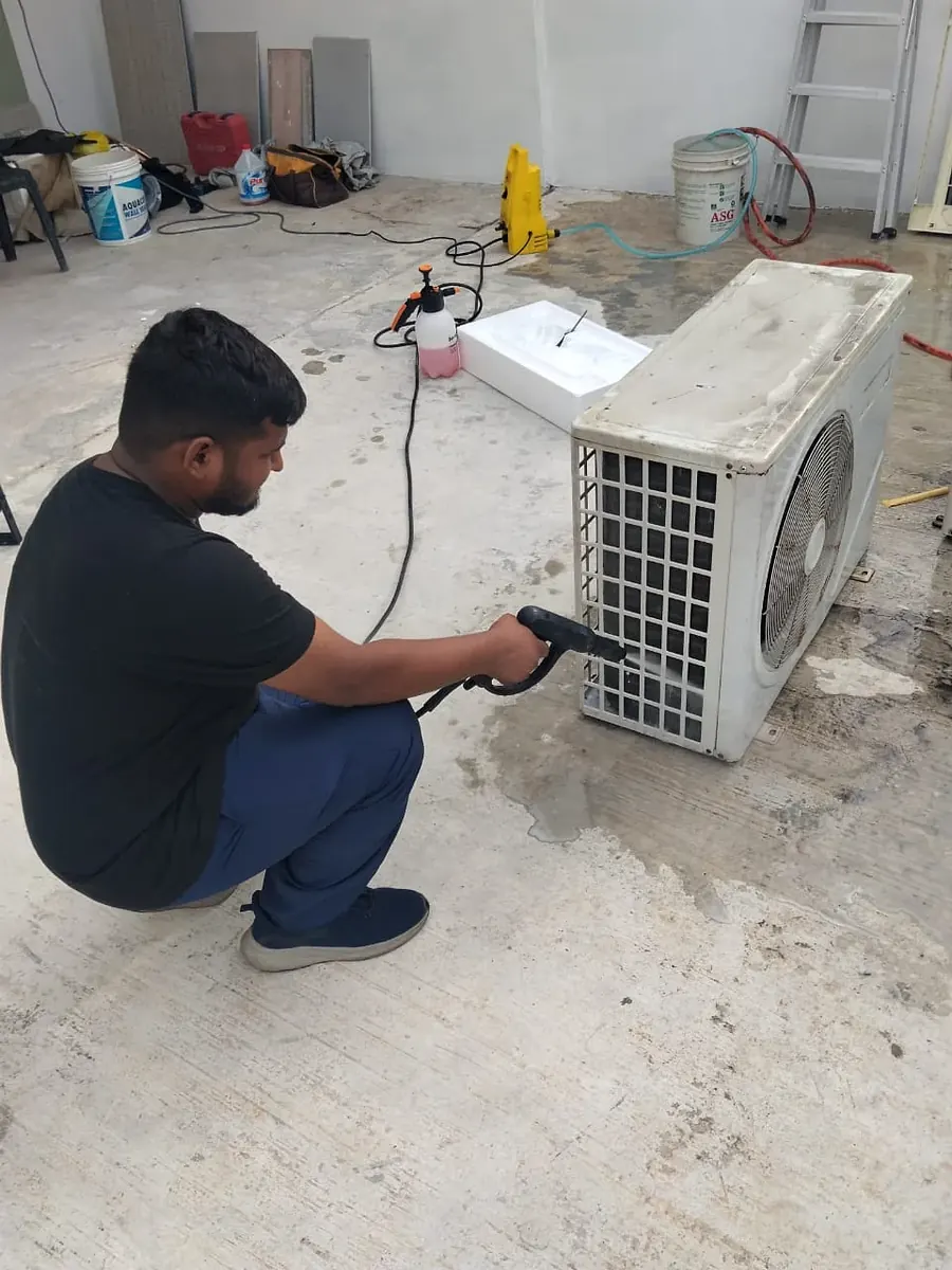 Aux aircond unit carefully dismantled for relocation in Kuala Lumpur
