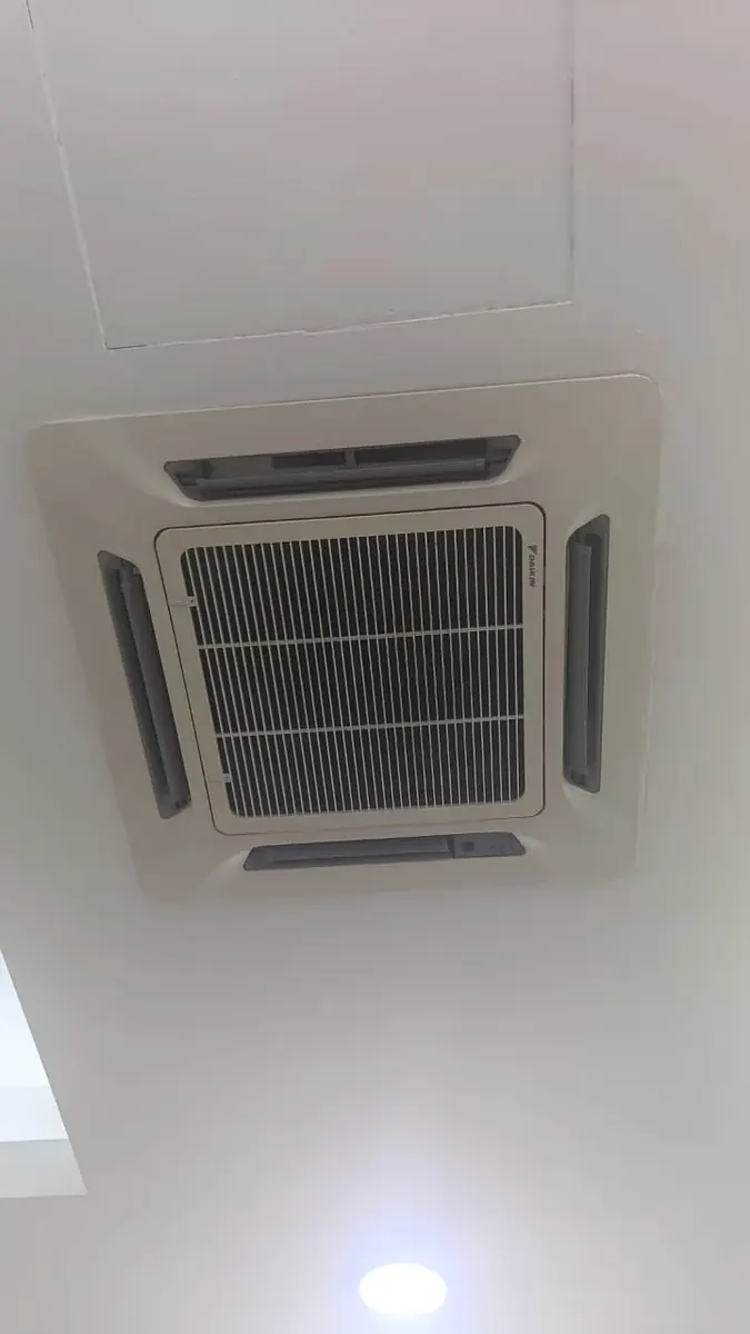 Daikin ceiling cassette aircond receiving scheduled maintenance in Shah Alam