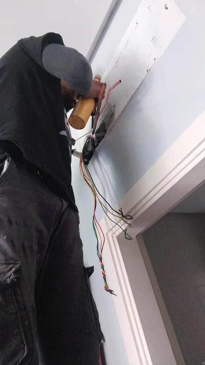 Samsung aircond unit being mounted and connected in a Petaling Jaya home