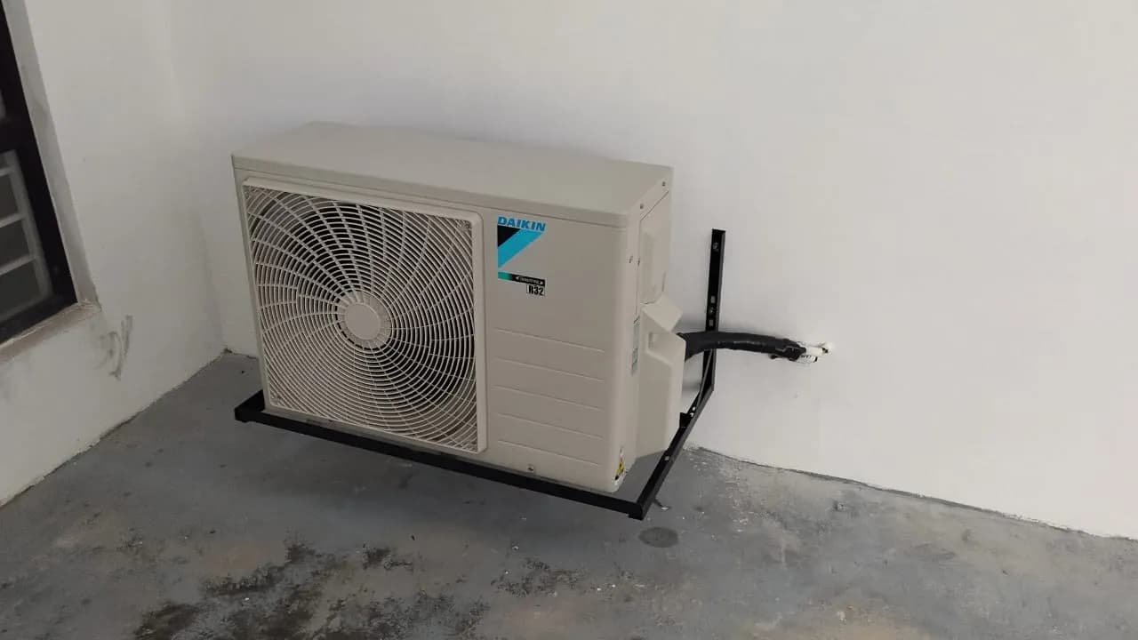 KL Renovator technician performing a new wall-mounted aircond installation on a Daikin unit in Sunway