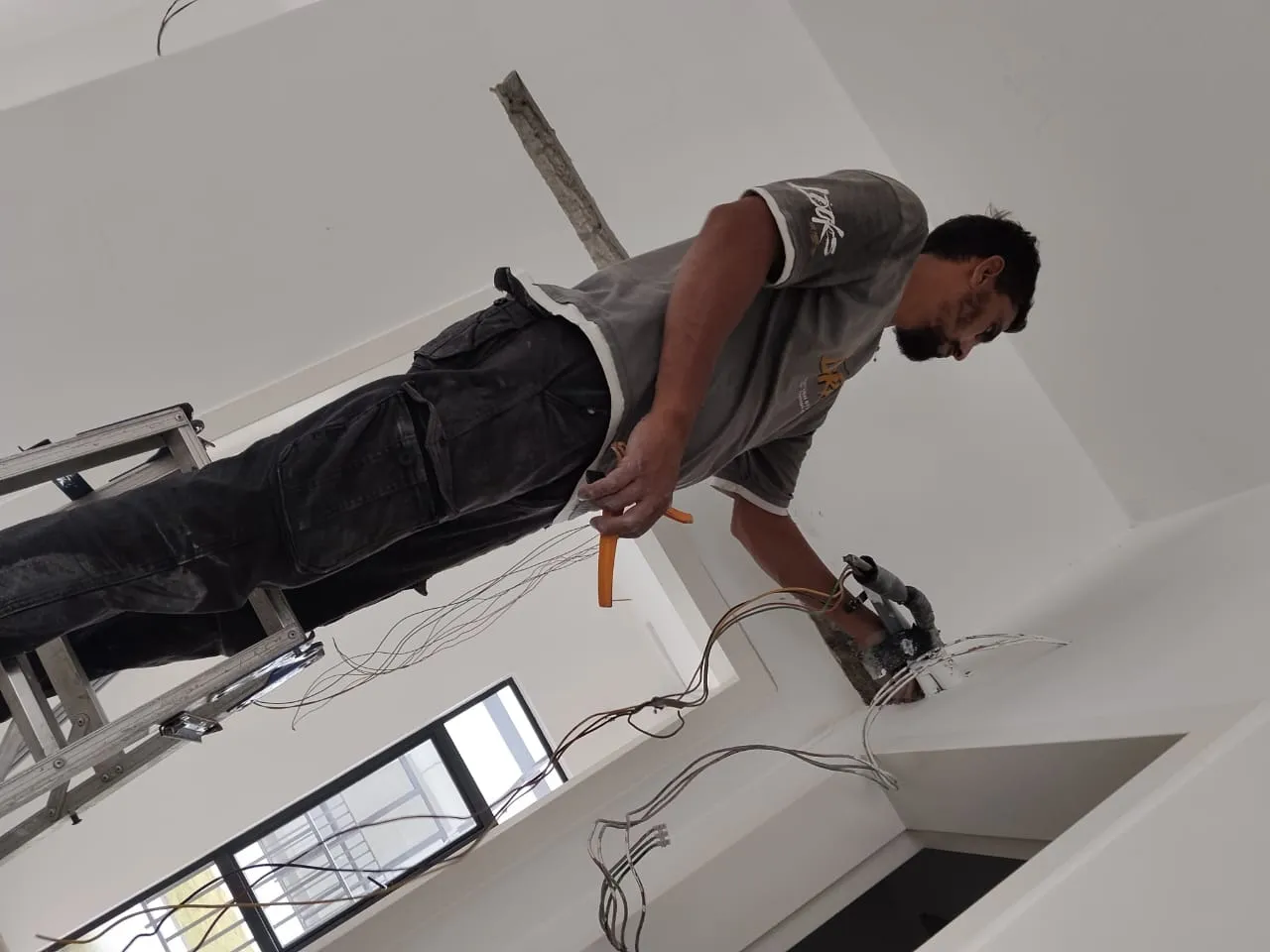 KL Renovator Privacy Policy: KL Renovator technician performing routine aircond servicing and coil cleaning on an aircond unit across KL & Selangor