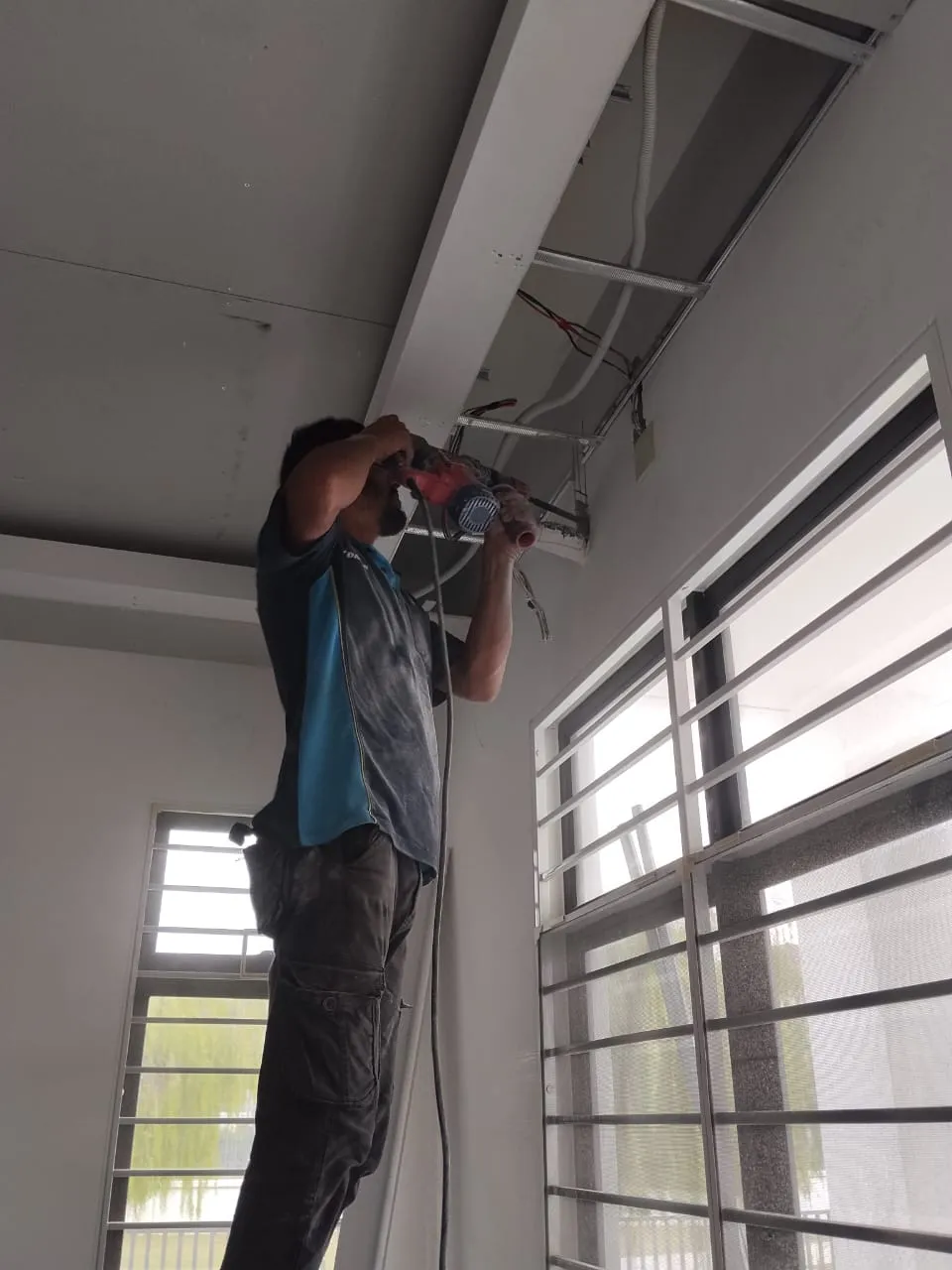 Indoor aircond unit removed from the wall and stripped down for a full chemical overhaul in Cheras