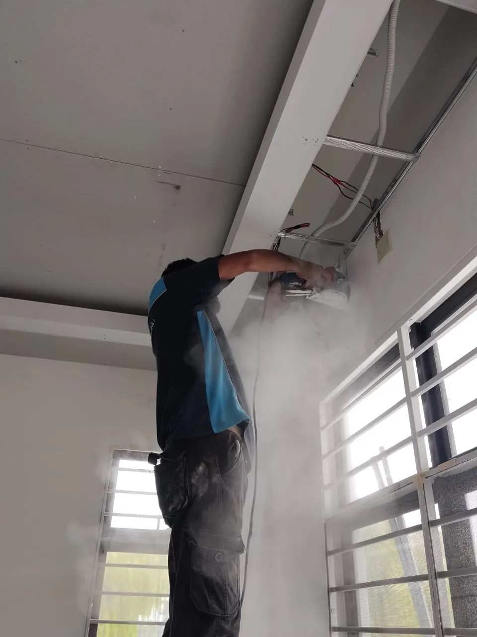 Back tray, drain pan and blower soaked and scrubbed separately during a chemical overhaul in Kuala Lumpur