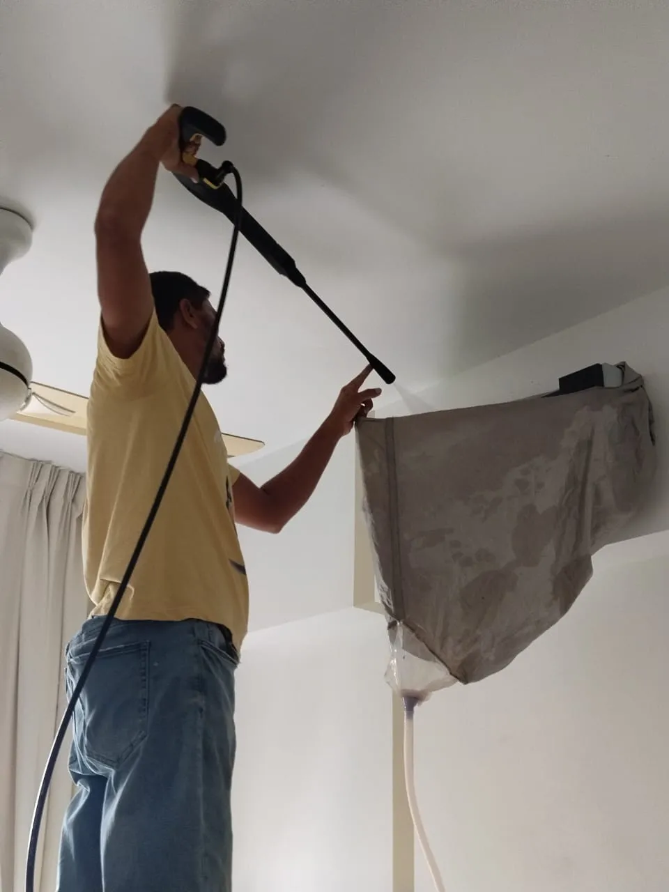 Muhammad, Owner & Founder of KL Renovator, on an aircond installation job in Ampang Selangor