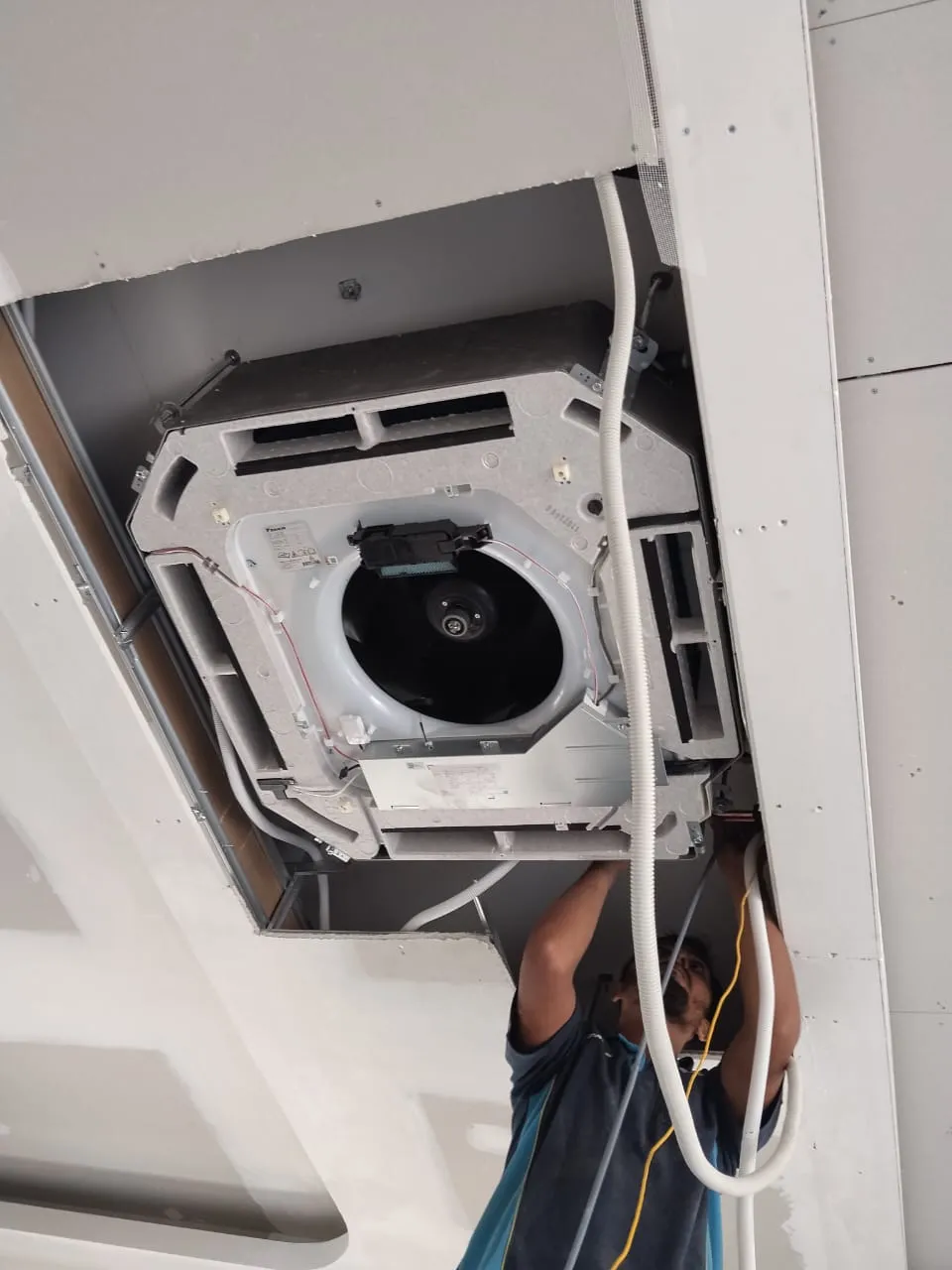 Hamzah, Service Technician with 1.5 years experience, performing a pressure chemical wash in Selangor